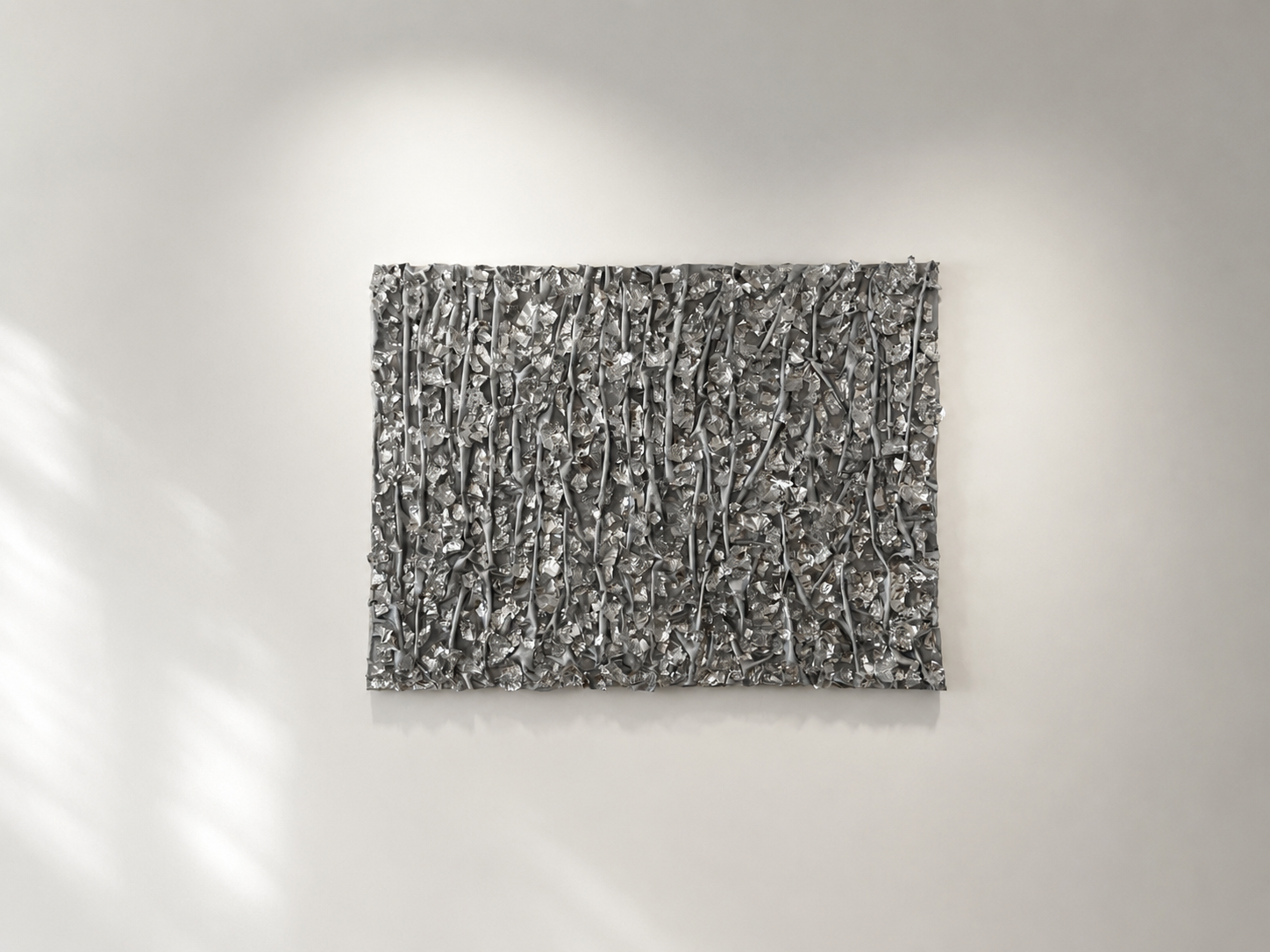 Silver metallic sculptural wall artwork