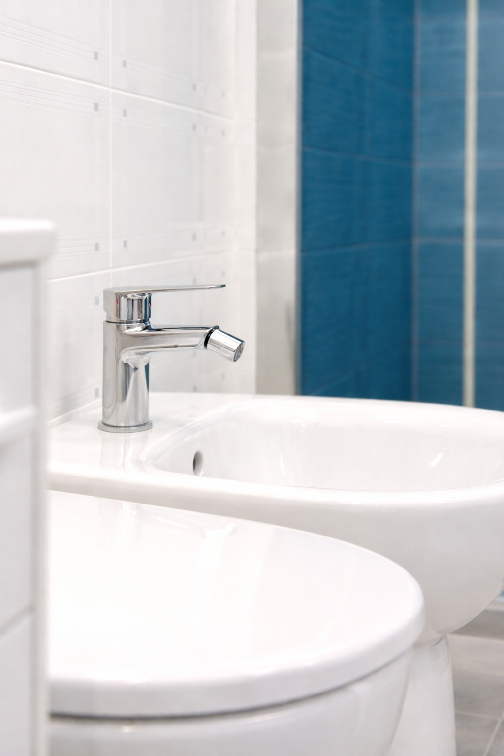 Bathroom detail with blue-tiled material palette
